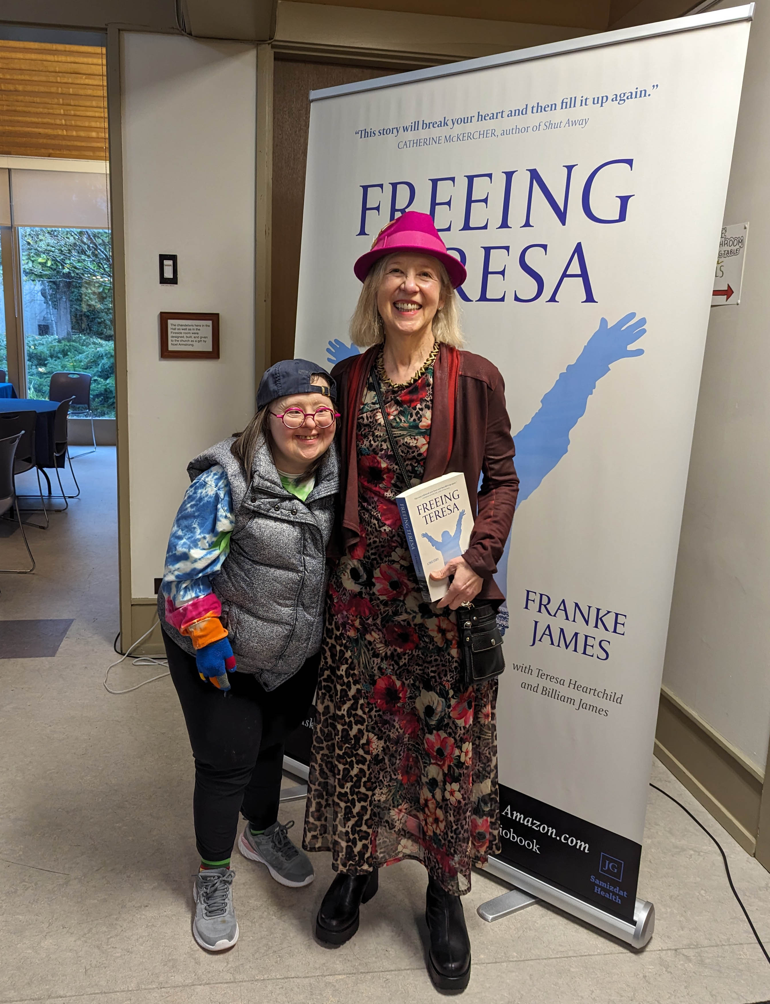 Franke James, author stands beside her sister Teresa Heartchild, contributor, at the book launch hosted by Spectrum Society